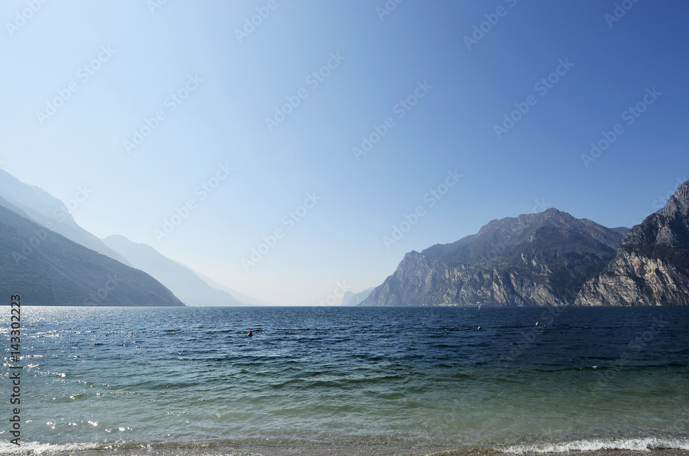 Lake Garda and the mountains seen from Torbole beach Lake Garda and the mountains seen from Torbole beach