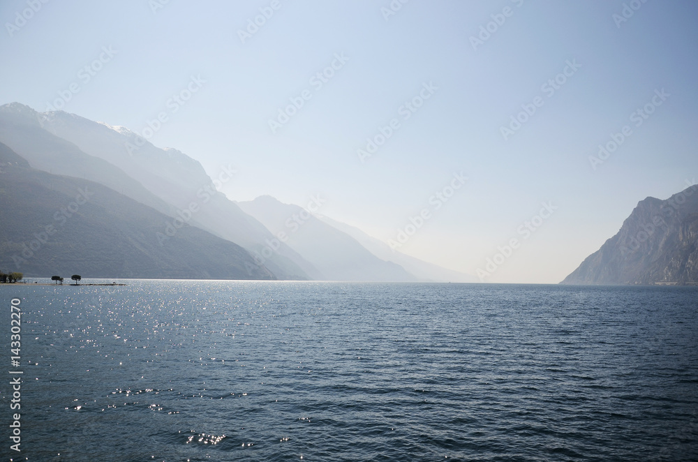 Lake Garda and the mountains seen from Torbole beach Lake Garda and the mountains seen from Torbole beach