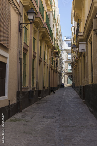 Narrow street with traditional architecture in Cadiz, Andalusia, southern Spain