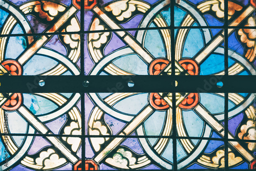 Image of a multicolored stained glass window.Stained glass in a cathedral with irregular block pattern