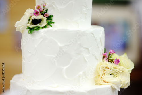 Traditional anniversary/wedding multi-layer cake with flowers
