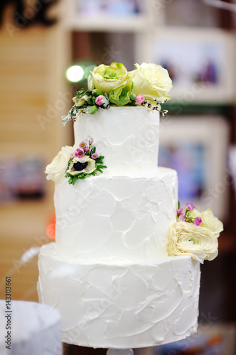Traditional anniversary/wedding multi-layer cake with flowers