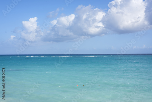 Big white clouds over the Caribbean Sea, tropical seascape, blue sky background photo