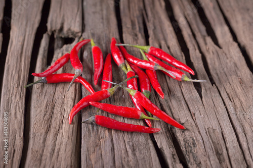 Red Hot Chili Peppers over wooden background