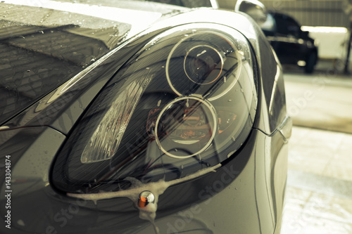 Modern car headlights on isolated white scenes