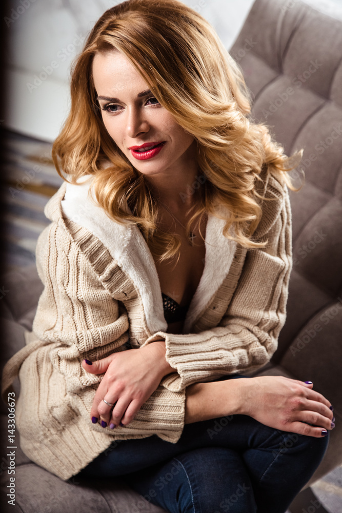 beautiful sexy young woman in a lingerie and warm clothes, casual style. fashion beauty portrait beautiful sexy young woman in a lingerie and warm clothes, casual style. fashion beauty portrait