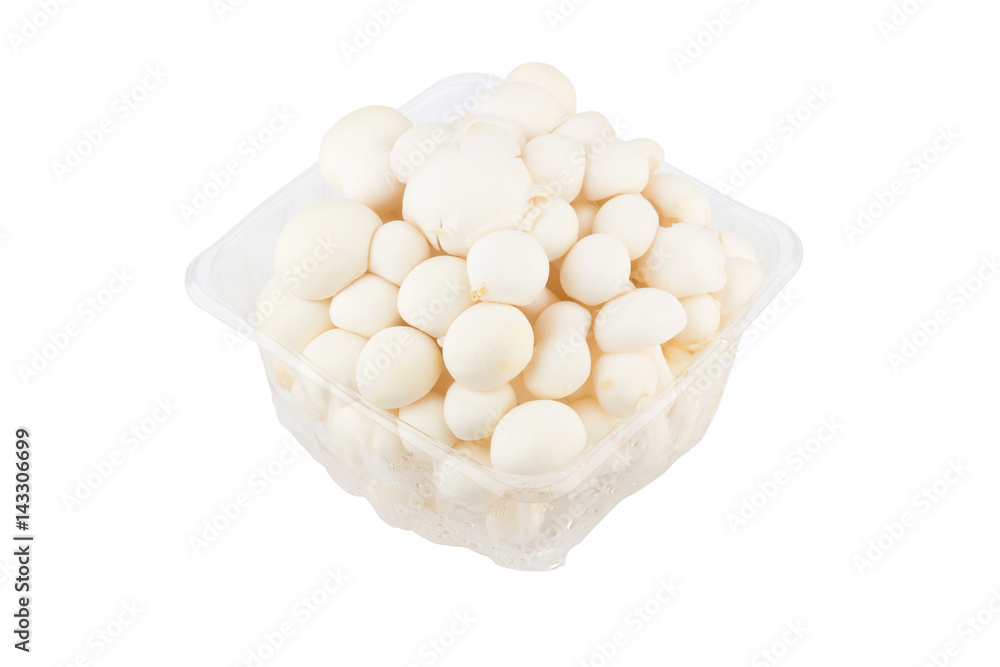 White shimeji mushrooms in box on white background White shimeji mushrooms in box on white background