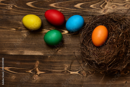 colorful eggs inside nest. Happy Easter concept