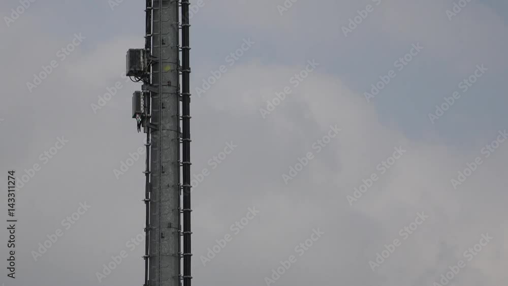 telecommunication radio antenna with cloudy sky telecommunication radio antenna with cloudy sky