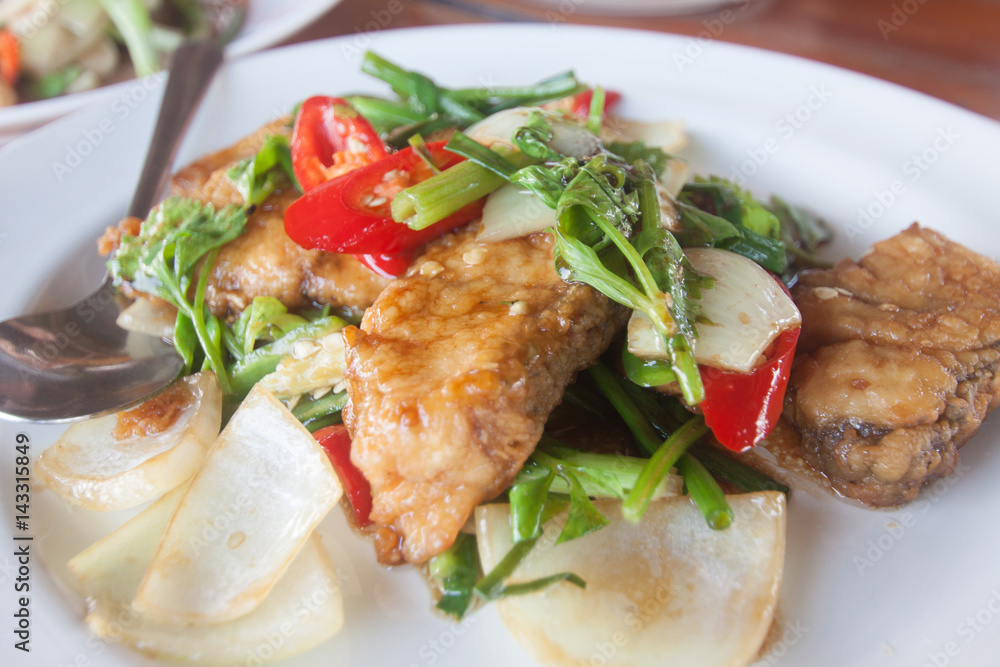 Thai food, stir fried fish with chili and onion. Thai food, stir fried fish with chili and onion.