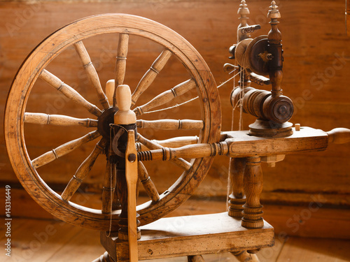 Oldfashioned wooden distaff, spindle, spinning wheel photo