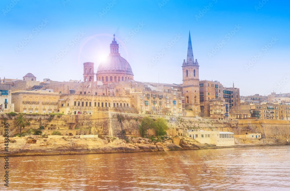 Fototapeta premium Old medieval architecture of Valletta village at sunset, Malta