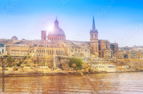 Old medieval architecture of Valletta village at sunset, Malta