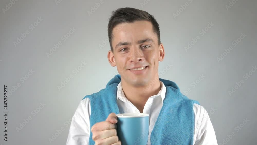 Young attractive guy. Smile and coffee. Young attractive guy. Smile and coffee.