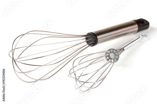 large and small metal whisk for whipping isolated on white background