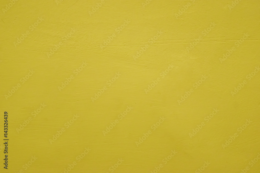 Obraz premium Warm tone yellow cement wall background clean vintage style and empty space for text, For web design or graphic art image and photography studio backdrop.