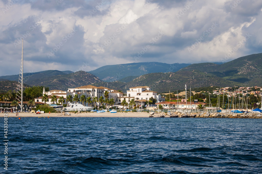Landscape of seashore with beautiful hills and hotels in Sardinia Italy Sardegna