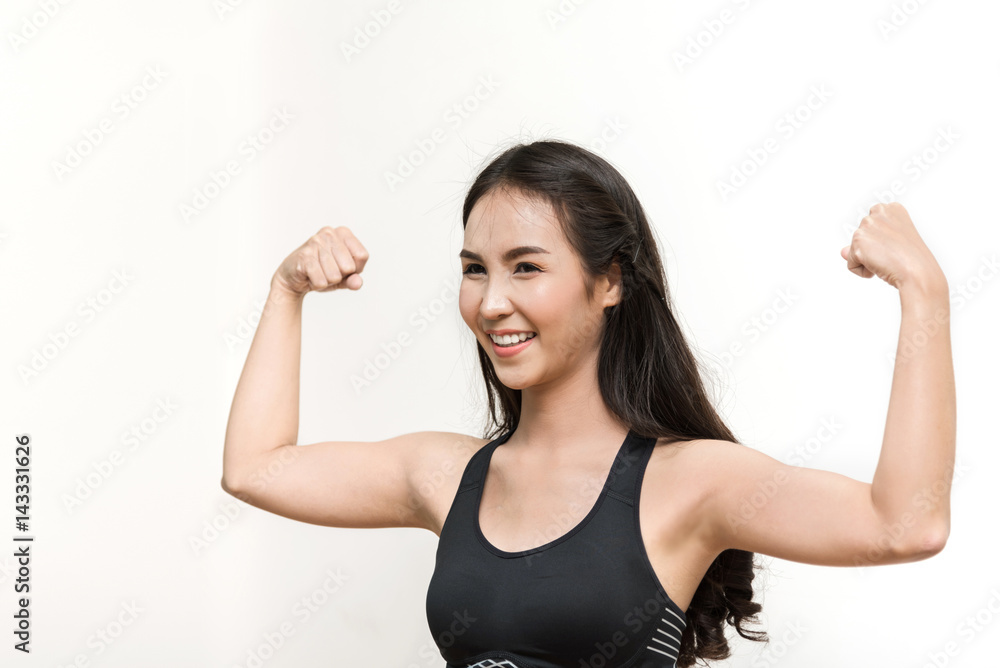 Young Asian woman working out in the gym. Happiness, smiling. Isolated background. Young Asian woman working out in the gym. Happiness, smiling. Isolated background.