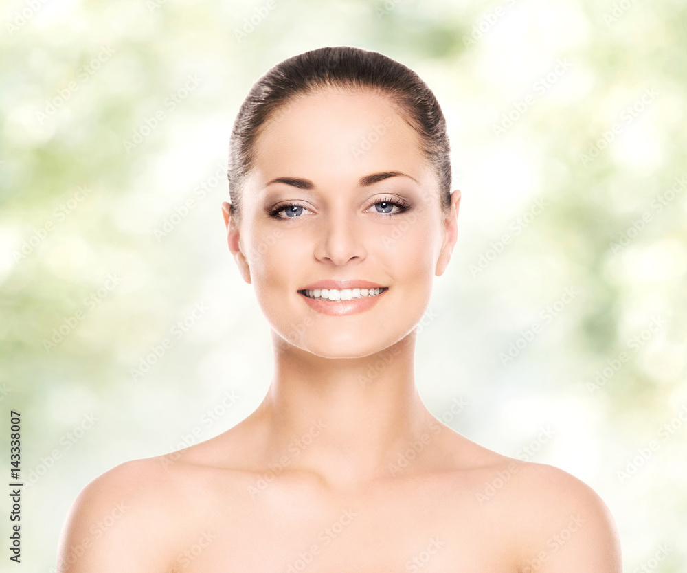 Portrait of young, beautiful and healthy woman: over spring and summer background. Healthcare, spa, makeup and face lifting concept.