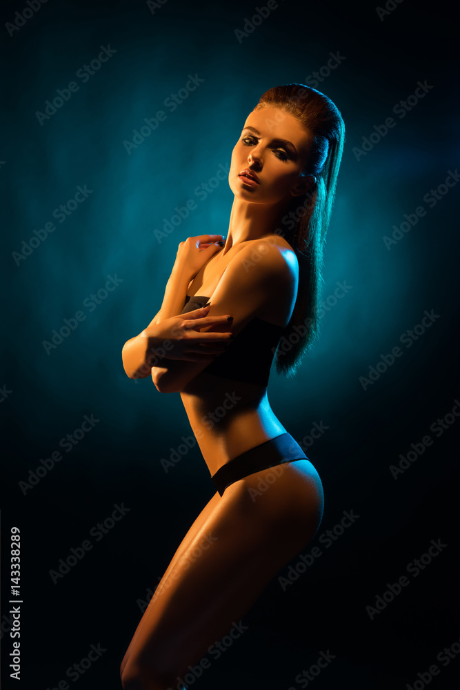 Young, beautiful and seductive girl posing in swimsuit. Mixed and fashionable lightning effect. Young, beautiful and seductive girl posing in swimsuit. Mixed and fashionable lightning effect.