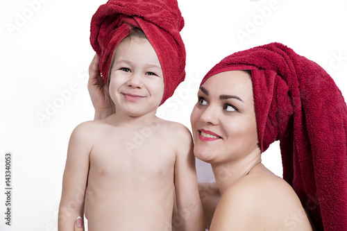 Smiling mother and daughter at bathtime