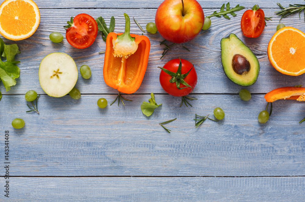 Border of fresh vegetables on blue wood background with copy space Border of fresh vegetables on blue wood background with copy space