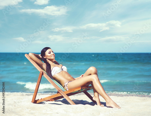 Young, beautiful, slim and sexy woman on the beach. Traveling, vacation, concept.