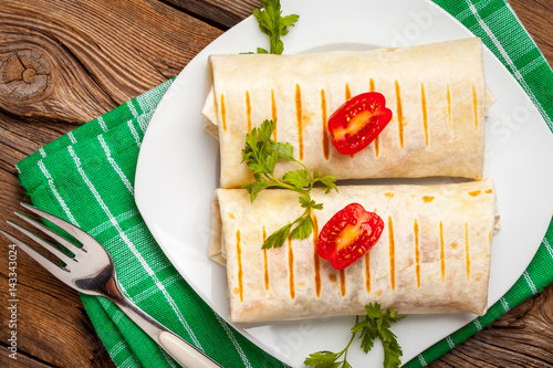 Burritos filled wiht minced meat, bean and vegetables.