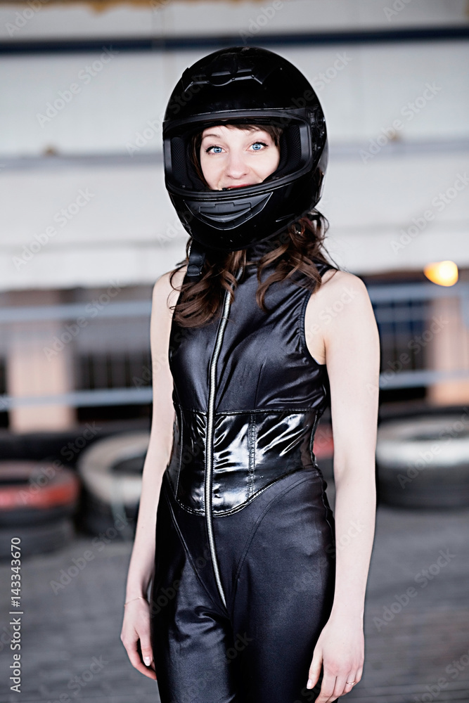 woman car racer in leather suit and helmet woman car racer in leather suit and helmet