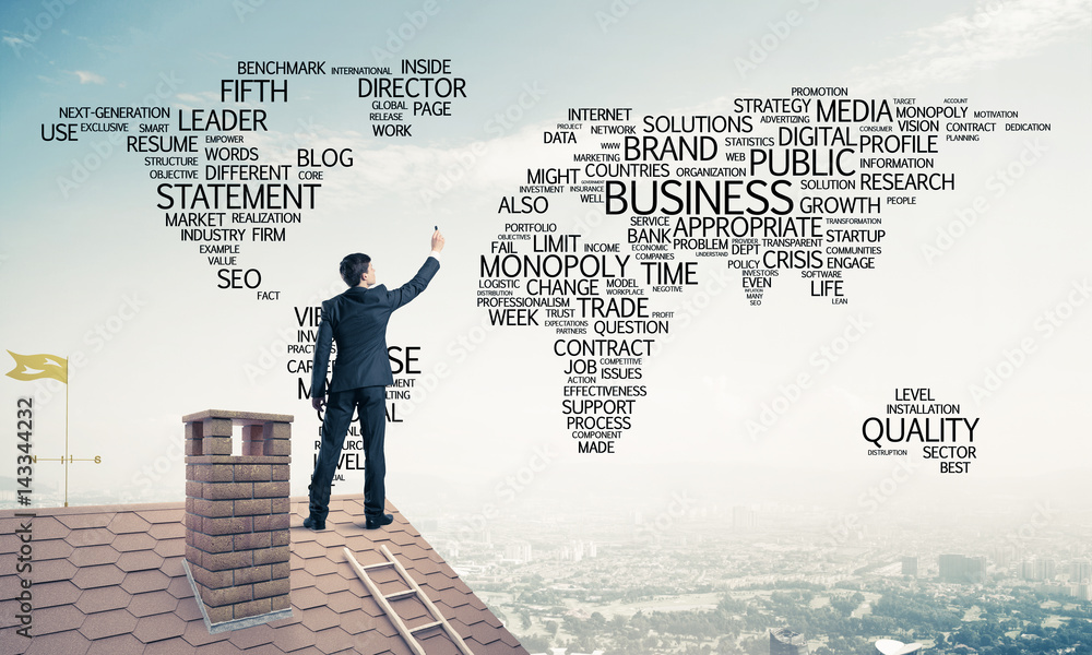 Businessman on brick roof draw world map as concept of globaliza Businessman on brick roof draw world map as concept of globaliza