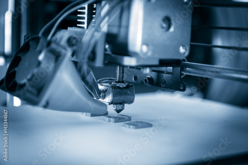 Electronic three dimensional plastic printer during work , 3D , printing.