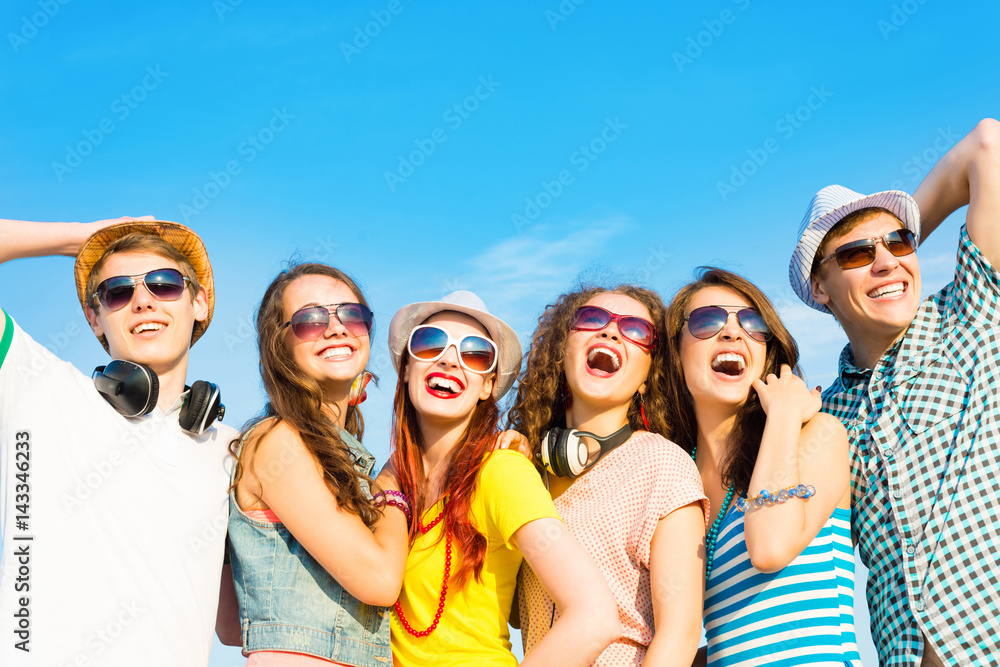 group of young people wearing sunglasses and hat group of young people wearing sunglasses and hat
