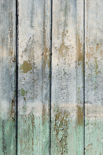 Old shabby vintage wooden wall painted pale blue and green