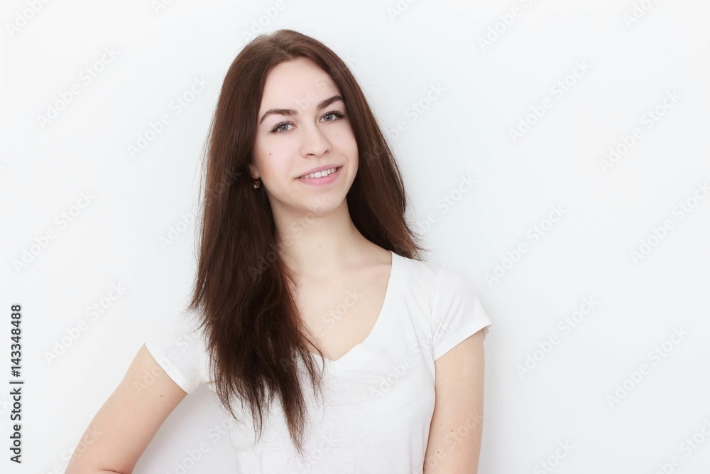 Young casual woman In pink blouse isolated over white background studio portrait Young casual woman In pink blouse isolated over white background studio portrait