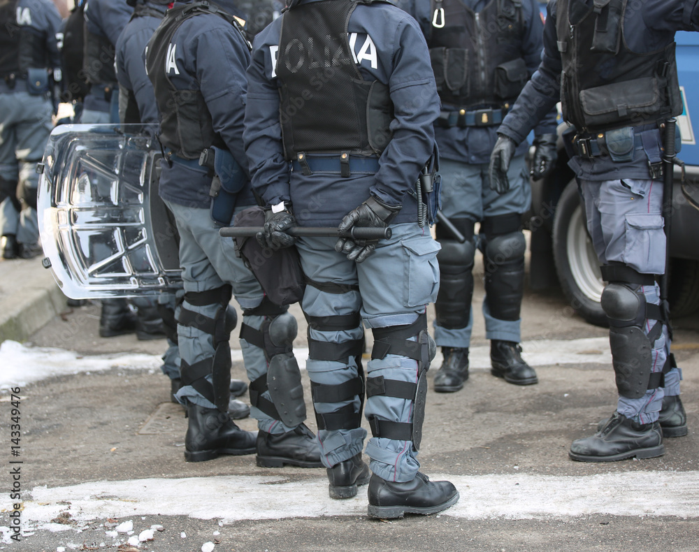 police with shields and riot gear during the sporting event