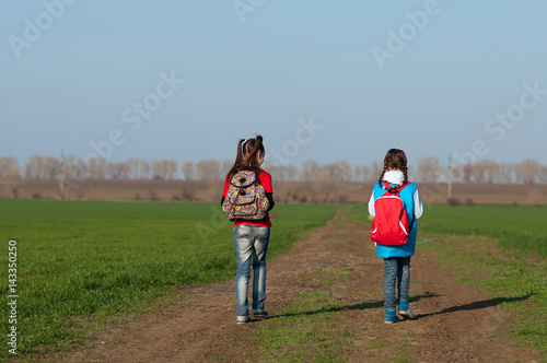 two girls,travel with a backpack