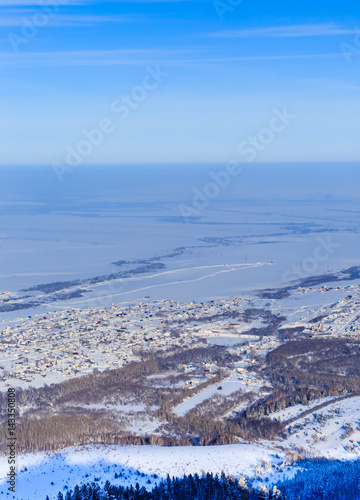 View from Tserkovka mountain to the resort town of Belokurikha in winter, Altai, Russia photo