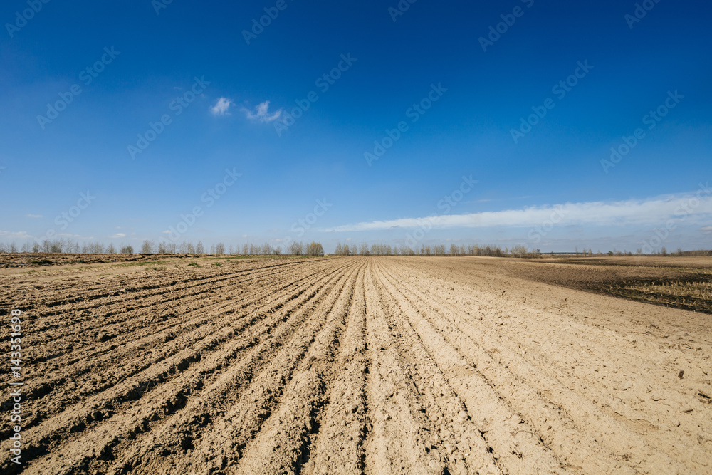 Ploughed field in spring prepared for sowing Ploughed field in spring prepared for sowing