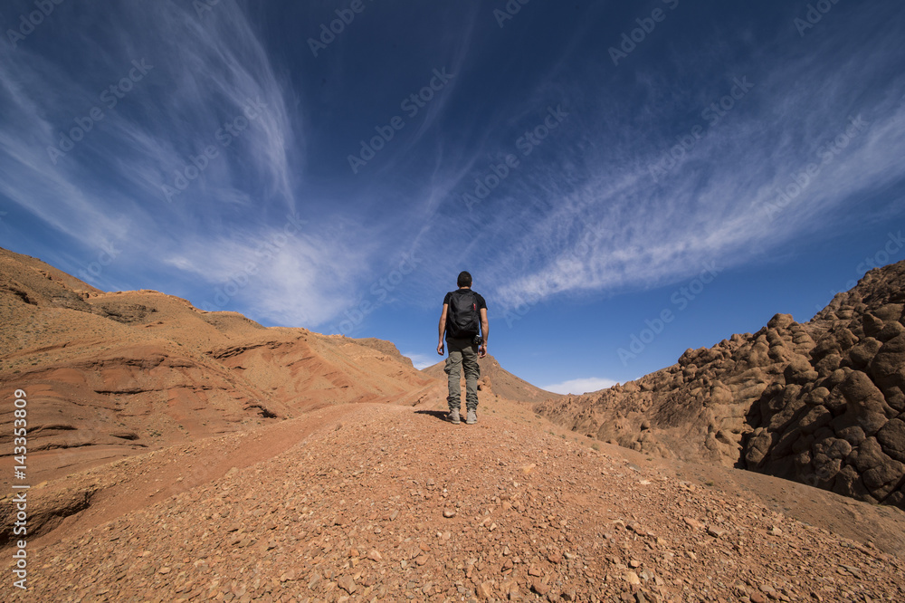 A man walks alone on the mountain in Morocco A man walks alone on the mountain in Morocco