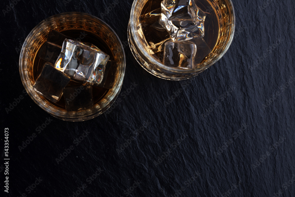 glass of whiskey with ice on a wooden glass of whiskey with ice on a wooden