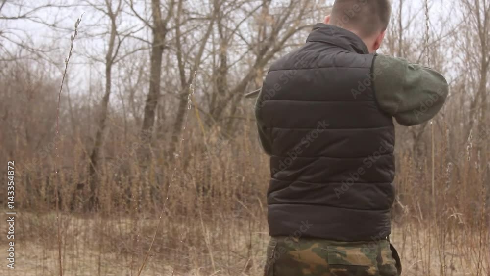 Hunter aiming the hunt during the hunting season. Hunter waiting silently for the hunt during the hunting season. Hunter in camouflage clothes with hunting rifle. Hunter aiming the hunt during the hunting season. Hunter waiting silently for the hunt during the hunting season. Hunter in camouflage clothes with hunting rifle.