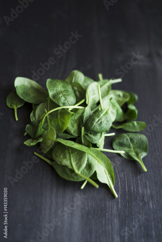 Leafy green vegetables on a wooden table