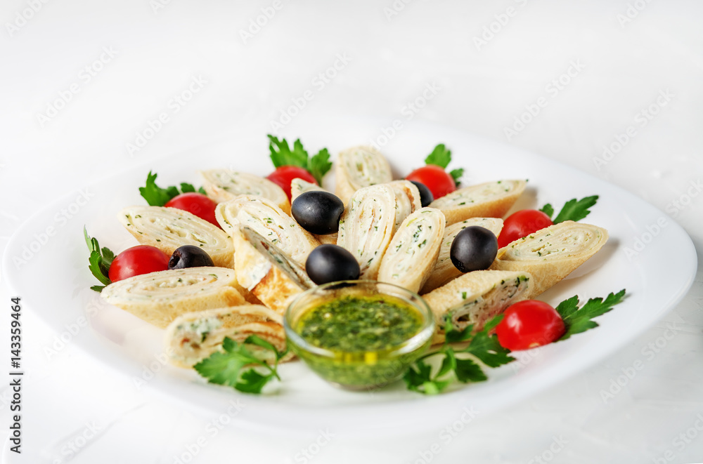 Pancake with feta cheese and herbs on a white background. The concept of healthy eating and vegetarianism.
