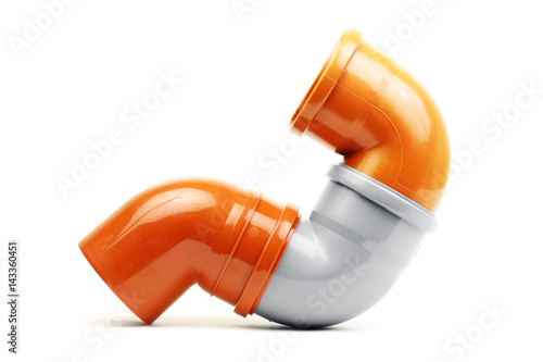 New grey and orange drain pvc pipe isolated on white