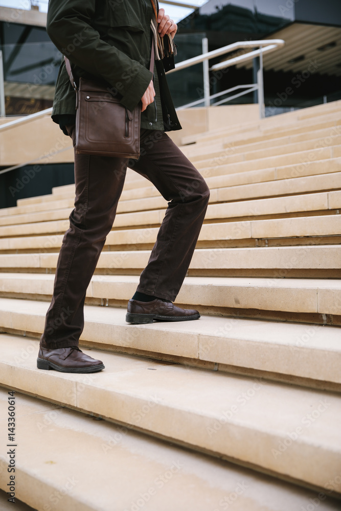 Man climbing the stairs Man climbing the stairs