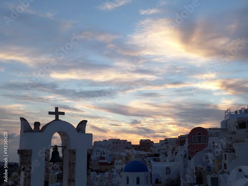 Greek church against stunning sunset sky at Oia village, Santorini island, Greece 