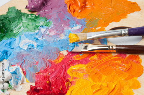 Artist's color palette with multi-colored oil paints
