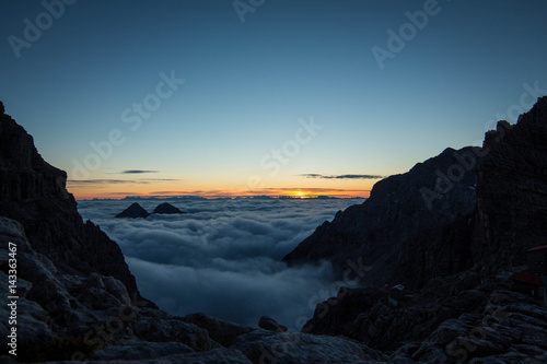 Sunrise above the clouds, Dolomites, Italy