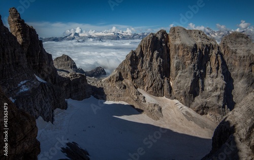 Glacier in the mountains above the clouds on a perfect day  Dolomites  Italy