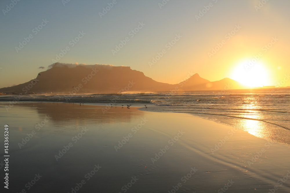 Beautiful sunset at Milnerton beach, showing the Table Mountain , Cape Town, South Africa